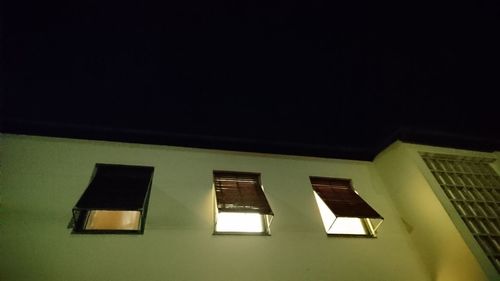 Low angle view of illuminated building at night