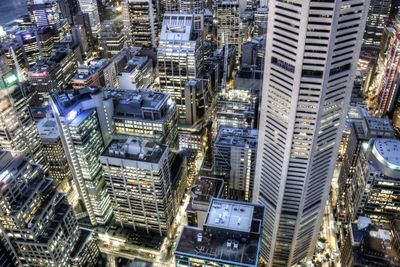 Aerial view of city lit up at night