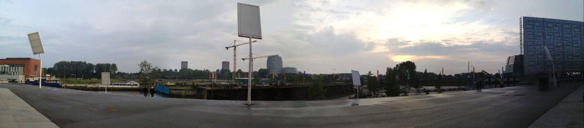 Buildings against cloudy sky