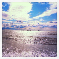 Scenic view of sea against cloudy sky