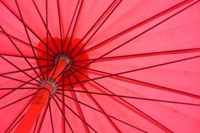 Low angle view of red umbrella