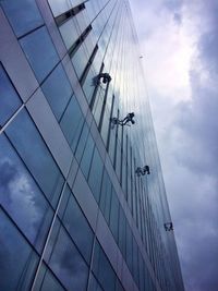 Low angle view of office building against sky