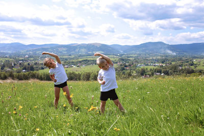 Full length of women on field against sky