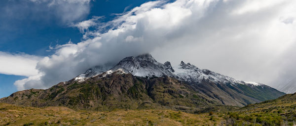 Panoramic view of snowcapped mountains against sky