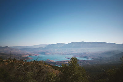 High angle view of mountains against clear blue sky