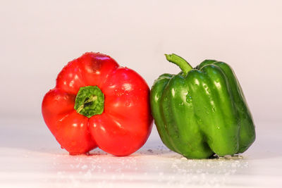 Close-up of bell peppers against white background