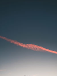 Low angle view of vapor trails in sky