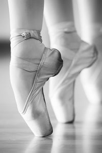 Low section of ballet dancer dancing in studio