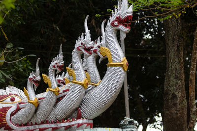 Statue of buddha against trees