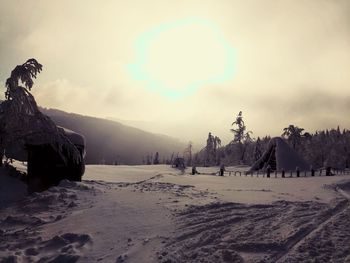 Scenic view of snow covered landscape against sky during winter