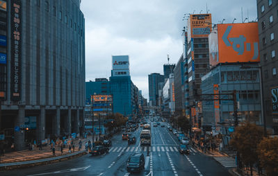 City street amidst buildings against sky