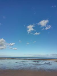 Scenic view of sea against blue sky