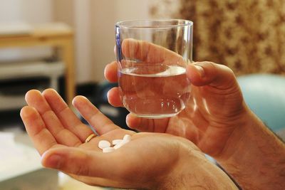 Close-up of hand holding drink