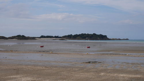 Scenic view of beach against sky