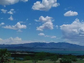 Scenic view of mountains against cloudy sky