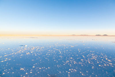 Scenic view of landscape against clear blue sky