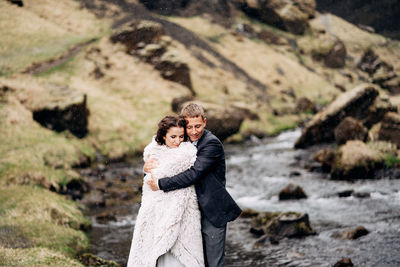 Portrait of a couple on rock