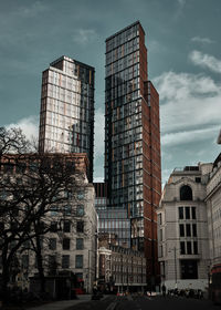 Low angle view of skyscrapers against sky