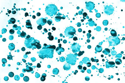 Close-up of bubbles over white background