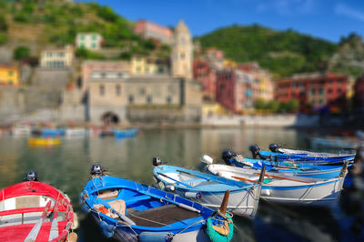 Close-up of multi colored moored boats in river