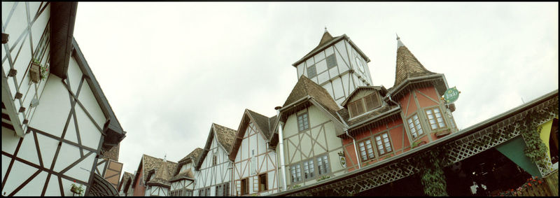 Low angle view of buildings against sky in city