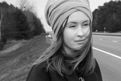 Portrait of a beautiful young woman outdoors