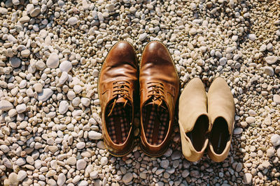 High angle view of shoes at beach