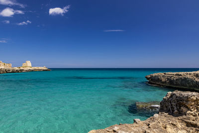 Scenic view of sea against blue sky