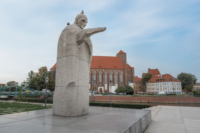 Low angle view of statue against sky