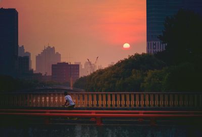 View of cityscape against sky during sunset