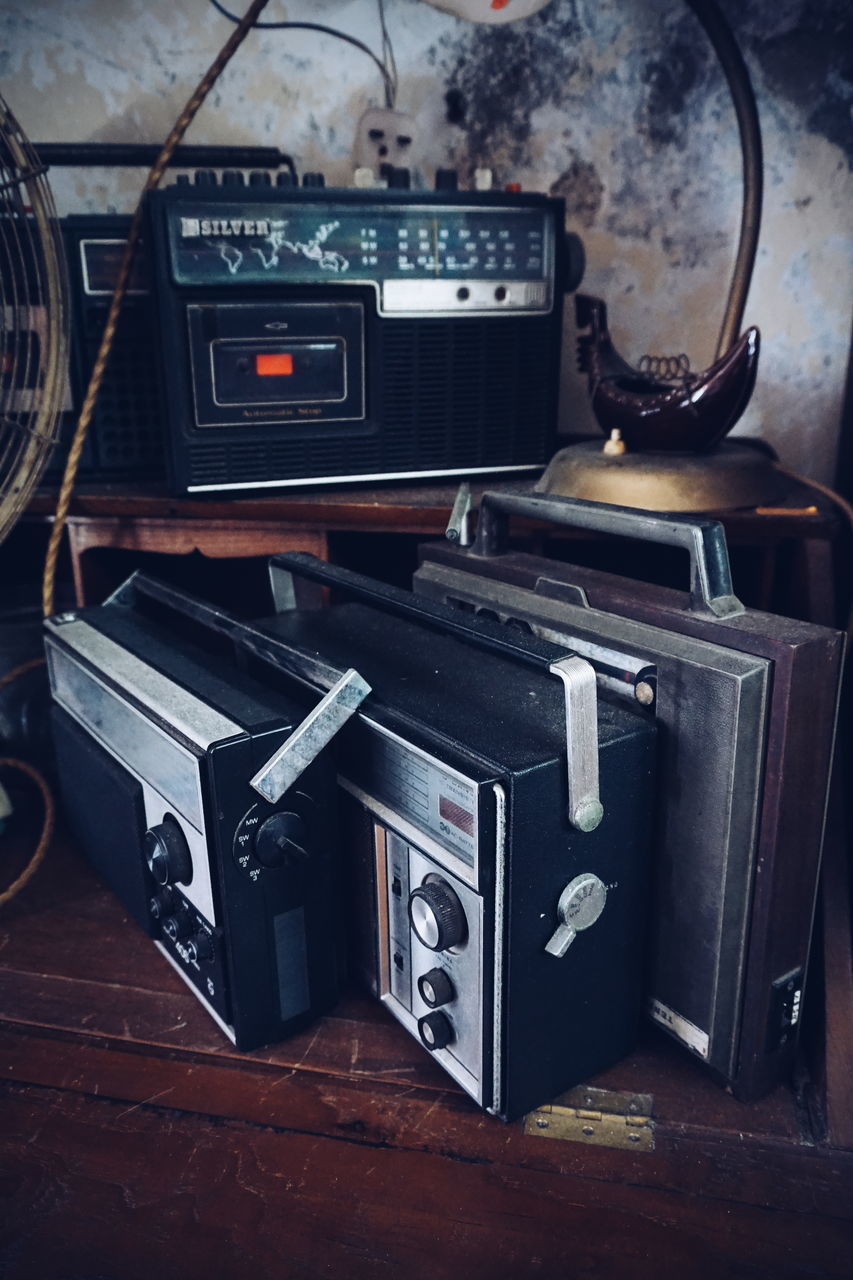 CLOSE-UP OF OLD CAMERA ON TABLE AT HOME