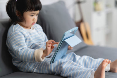 Boy using digital tablet