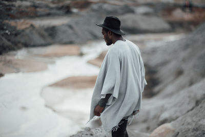 Side view of man standing in water