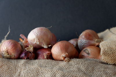 Close-up of pumpkins on table against black background