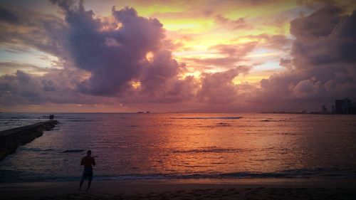 Scenic view of sea against cloudy sky