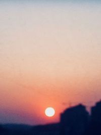 Low angle view of moon at sunset