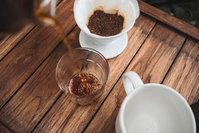 Barista dripping coffee and slow coffee bar style