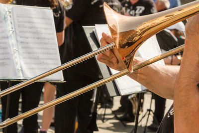 Close-up of person playing musical instrument