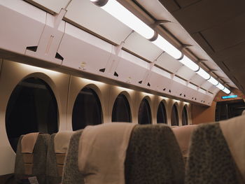 Empty seats in illuminated airplane