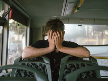 Depressed man in bus