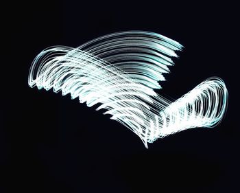 Blurred motion of text against black background