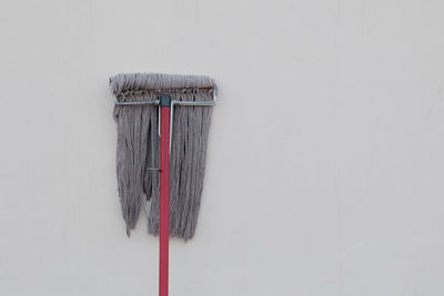 Directly above shot of clothes on wall against white background