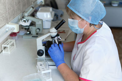 Doctor examining patient in laboratory