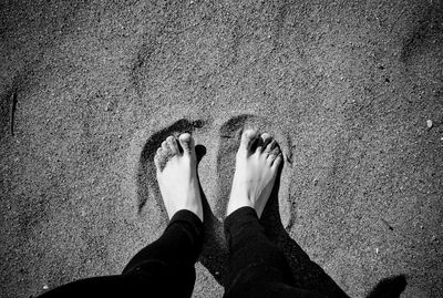 Low section of woman standing on land