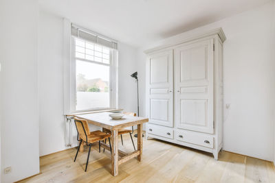 View of dining table by window at home