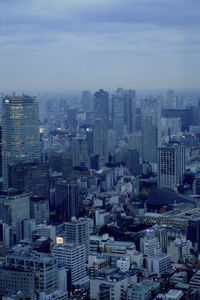 High angle view of buildings in city against sky