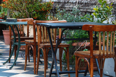 Empty chairs and tables in restaurant