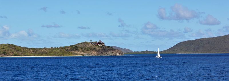 Scenic view of sea against blue sky