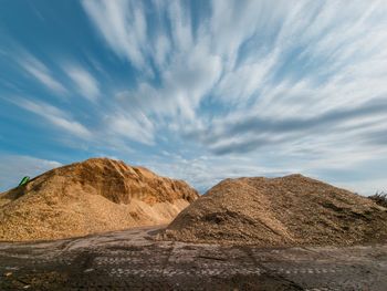 Low angle view of rock formations against sky