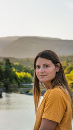 Portrait of woman against sky